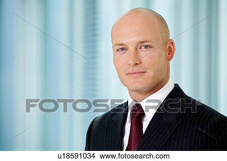 Picture - Portrait of young caucasian businessman in office. Fotosearch