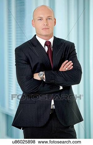 Portrait of young caucasian businessman in office View Large Photo Image Stock Photo - Portrait of young caucasian businessman in office. Fotosearch