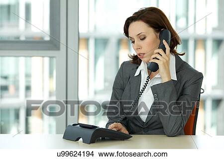 Picture - portrait of young confident caucasian businesswoman. Fotosearch