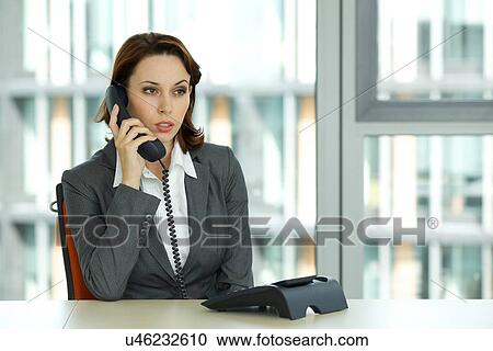 Stock Image - portrait of young confident caucasian businesswoman. Fotosearch