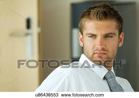 portrait of young confident caucasian businessman View Large Photo Image Stock Image - portrait of young confident caucasian businessman. Fotosearch