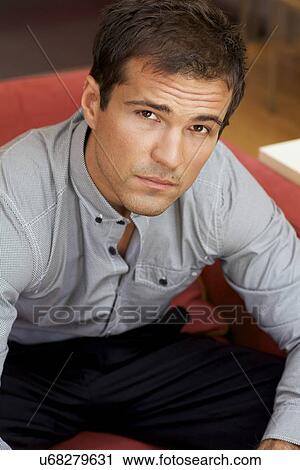 Portrait of young man contemplating View Large Photo Image Stock Image - Portrait of young man contemplating. Fotosearch