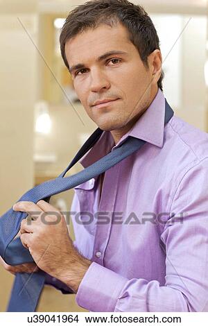 Portrait of young man wearing tie View Large Photo Image Picture - Portrait of young man wearing tie. Fotosearch