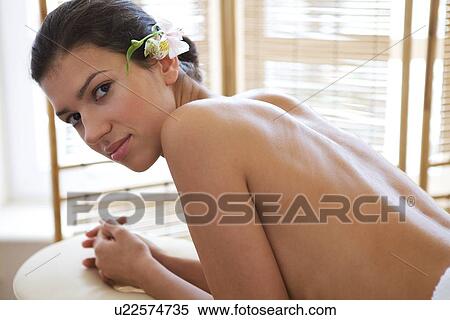Portrait of young woman relaxing on massage table View Large Photo Image Stock Photography - Portrait of young woman relaxing on massage table. Fotosearch