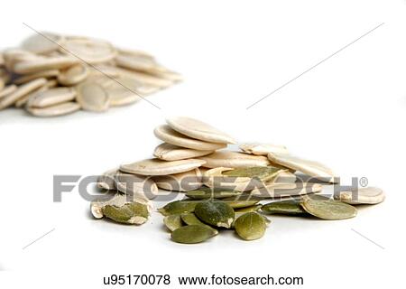 Pumpkin seeds on whote background View Large Photo Image Stock Photo - Pumpkin seeds on whote background. Fotosearch