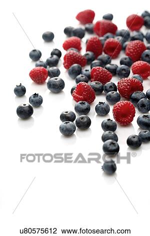 Raspberries and blueberries on white background View Large Photo Image Stock Image - Raspberries and blueberries on white background. Fotosearch