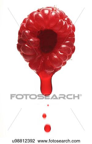 Stock Image - Raspberry on white background - close-up. Fotosearch