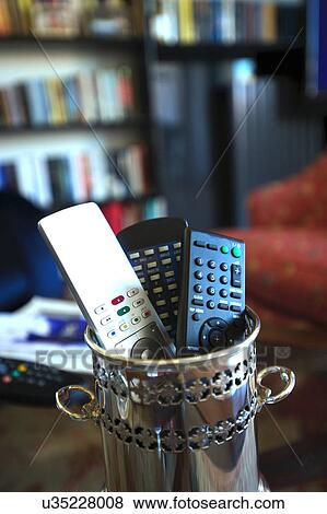 Remote controls at home View Large Photo Image Stock Photo - Remote controls at home. Fotosearch
