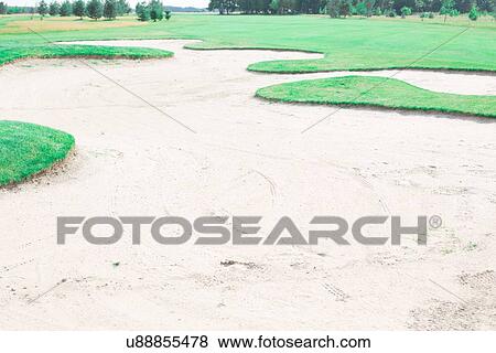 Stock Photo - Sand trap at golf course. Fotosearch