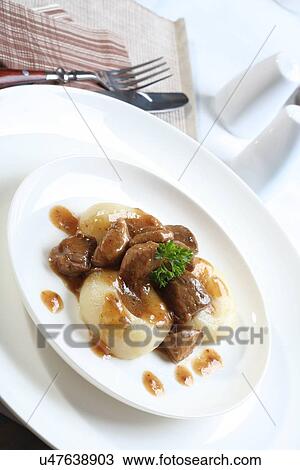 Silesian dumplings on white plate View Large Photo Image Stock Image - Silesian dumplings on white plate. Fotosearch