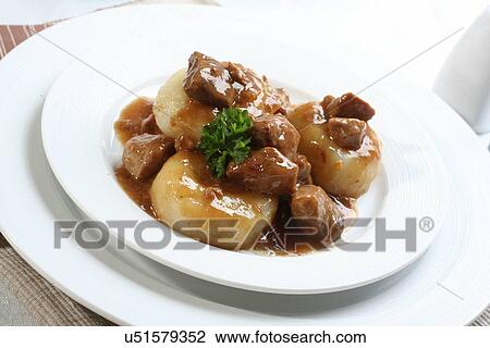Stock Image - Silesian dumplings on white plate. Fotosearch