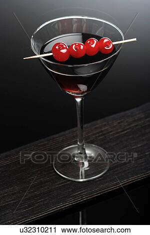 Studio shot of drink in martini glass View Large Photo Image Stock Image - Studio shot of drink in martini glass. Fotosearch