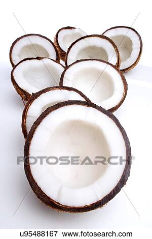 Studio shot of halved coconuts View Large Photo Image Stock Photo - Studio shot of halved coconuts. Fotosearch