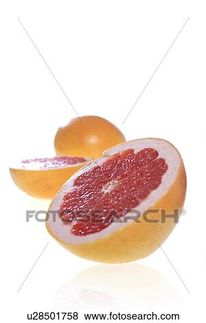Stock Photo - Studio shot of halved grapefruits. Fotosearch