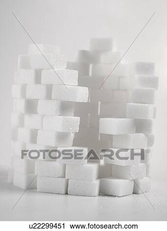 Stock Image - Studio shot of lump sugar. Fotosearch