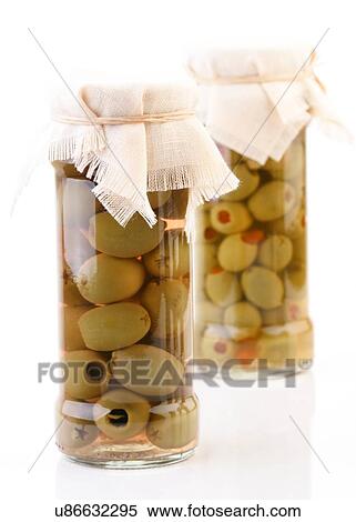 Stock Photography - Studio shot of pickled olives in jar. Fotosearch