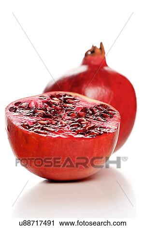 Stock Image - Studio shot of pomegranate fruit. Fotosearch