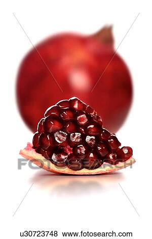 Stock Photo - Studio shot of pomegranate fruit. Fotosearch