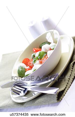 Studio shot of tomato and mozarella salad View Large Photo Image Stock Photography - Studio shot of tomato and mozarella salad. Fotosearch