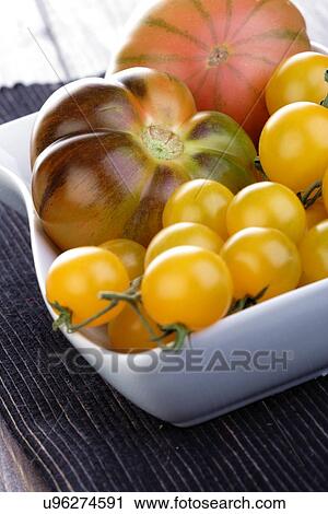 Studio shot of tomatos in dish View Large Photo Image Stock Image - Studio shot of tomatos in dish. Fotosearch