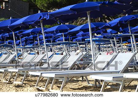 Sun beds and Parasols View Large Photo Image Stock Image - Sun beds and Parasols. Fotosearch
