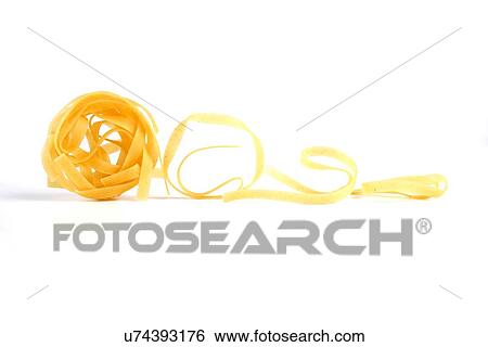 Stock Photograph - Tagliatelle pasta on white background. Fotosearch