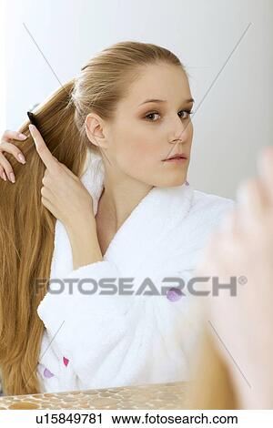 Woman brushing hair View Large Photo Image Stock Image - Woman brushing hair. Fotosearch