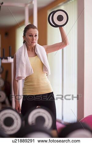 Woman lifting weight View Large Photo Image Stock Image - Woman lifting weight. Fotosearch