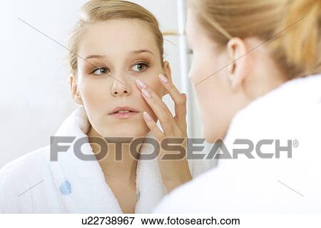 Stock Photo - woman reflexion in mirror. Fotosearch