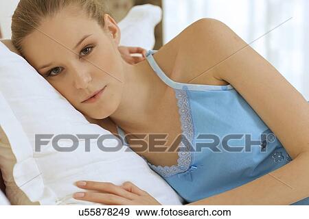 Stock Photo - Woman Relaxing on bed. Fotosearch