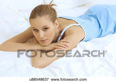 Stock Photo - Woman Relaxing on bed. Fotosearch