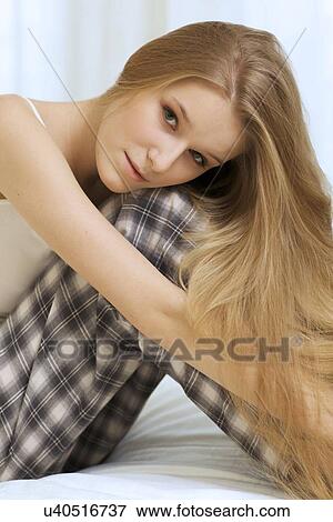 Woman sitting in bed View Large Photo Image Stock Photo - Woman sitting in bed. Fotosearch