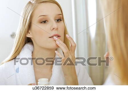 Woman touching lips View Large Photo Image Stock Photo - Woman touching lips. Fotosearch
