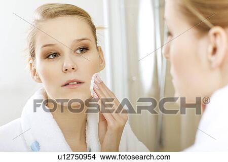Picture - Woman using dabber, portrait, close-up. Fotosearch