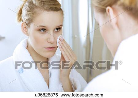 Woman using dabber, portrait, close-up View Large Photo Image Stock Photography - Woman using dabber, portrait, close-up. Fotosearch
