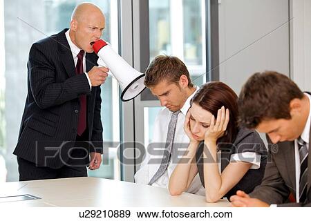 Young confident caucasian businessman screaming on his employee View Large Photo Image Stock Photo - Young confident caucasian businessman screaming on his employee. Fotosearch