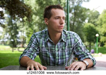 Young man contemplating View Large Photo Image Stock Photo - Young man contemplating. Fotosearch