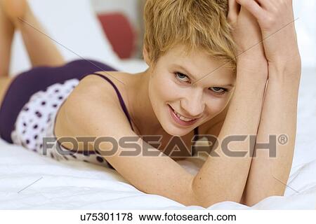 young woman in bed View Large Photo Image Stock Photo - young woman in bed. Fotosearch