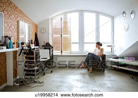 Young woman reading book at beauty spa View Large Photo Image Picture - Young woman reading book at beauty spa. Fotosearch