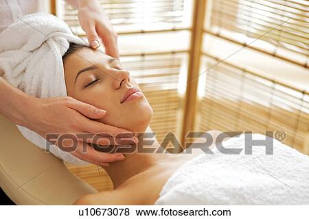 Young woman receiving massage, eyes closed View Large Photo Image Stock Photo - Young woman receiving massage, eyes closed. Fotosearch