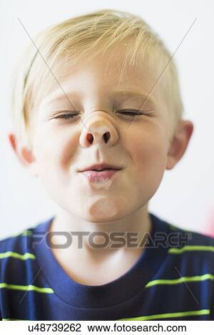 Boy (2-3) making funny face behind window View Large Photo Image Stock Image - Boy (2-3) making funny face behind window. Fotosearch