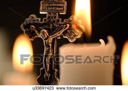 Burning candles and cross View Large Photo Image Stock Image - Burning candles and cross . Fotosearch