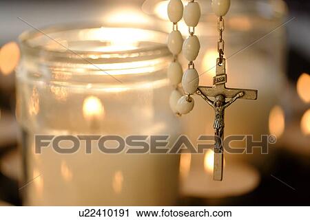 Burning candles with rosary in foreground View Large Photo Image Stock Image - Burning candles with rosary in foreground. Fotosearch