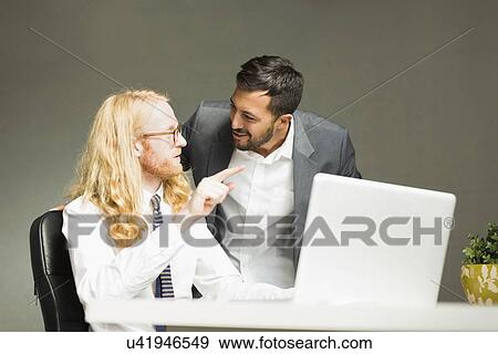Businessmen talking in office View Large Photo Image Stock Photo - Businessmen talking in office. Fotosearch