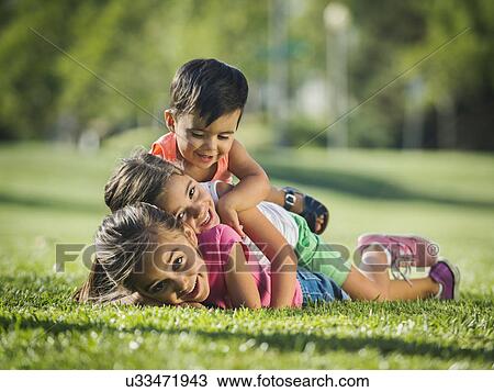 Children (2-3, 6-7, 8-9) playing in park View Large Photo Image Stock Image - Children (2-3, 6-7, 8-9) playing in park. Fotosearch