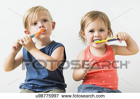 Children (2-3) brushing teeth View Large Photo Image Stock Photo - Children (2-3) brushing teeth. Fotosearch
