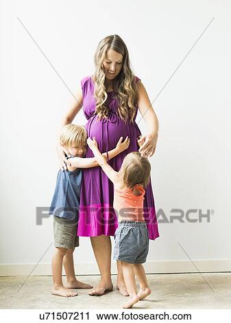 Children (2-3) hugging pregnant mother View Large Photo Image Stock Image - Children (2-3) hugging pregnant mother. Fotosearch