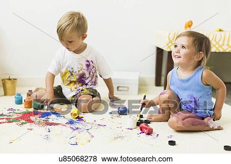 Children (2-3) painting on carpet View Large Photo Image Stock Photo - Children (2-3) painting on carpet. Fotosearch