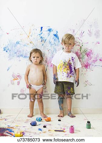 Children (2-3) painting on wall View Large Photo Image Stock Image - Children (2-3) painting on wall. Fotosearch