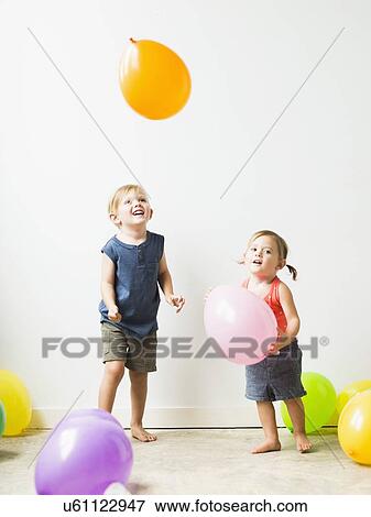 Children (2-3) playing with balloons View Large Photo Image Stock Photo - Children (2-3) playing with balloons. Fotosearch